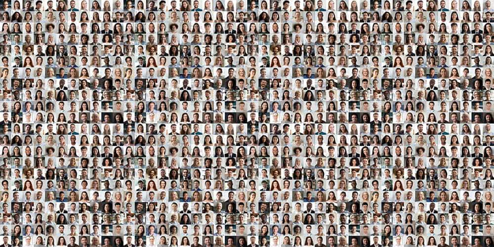 Many diverse people in a large group photo symbolizing community and collaboration.